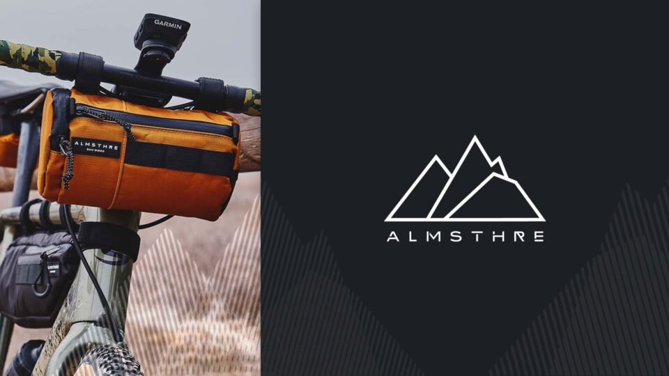 Orange bike bag with ALMSTHRE logo