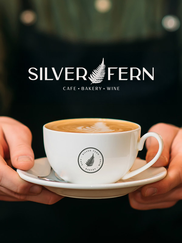 Silver Fern Cafe coffee cup with latte art.