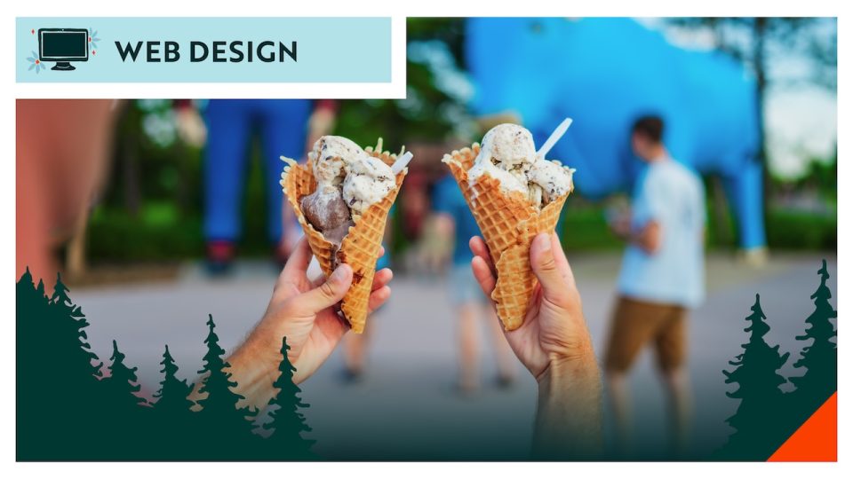 Two hands holding ice cream waffle cones outdoors